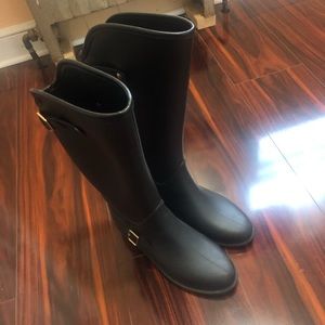 Knee high rain boots